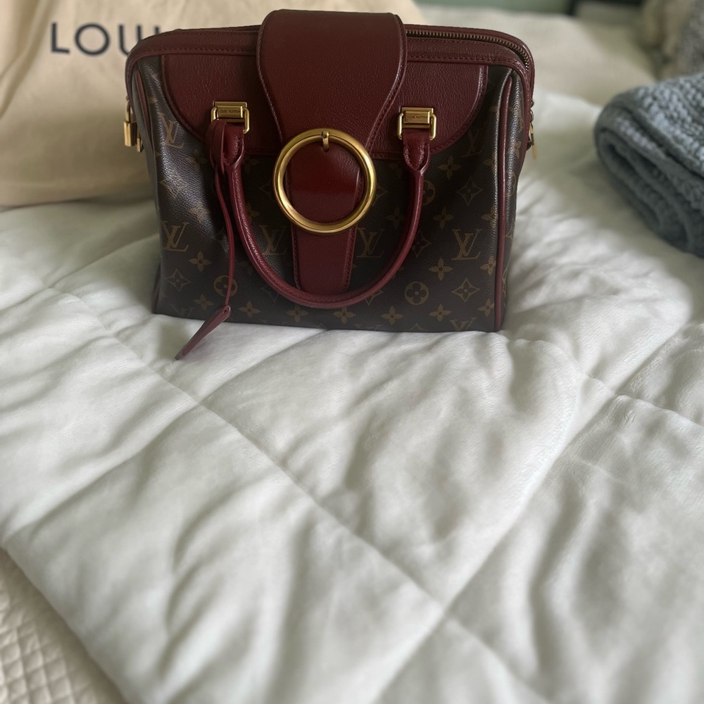 LOUIS VUITTON Monogram Golden Arrow Speedy in Burgundy.